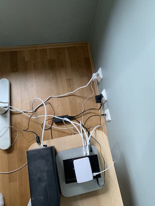 picture of the homelab before intervening with cables on the floor